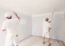 How do you spray paint a wall?