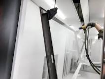 How do you clean a powder coating booth?