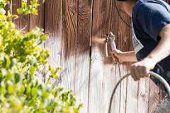 Do you need to prep a fence before staining?