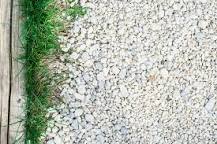How do I keep weeds from growing in my gravel driveway?