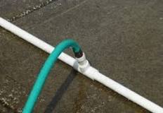 How do you connect a garden hose to a PVC pipe?