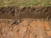 How do you dig a trench in clay soil?