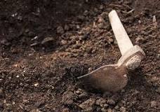 How do you dig a trench in rocky soil?