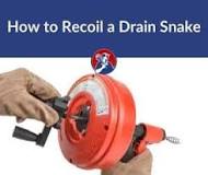 How do you recoil a drain snake?