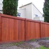 How many coats of stain do I need for a fence?