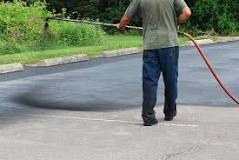 Is it better to spray or roll on asphalt sealer?