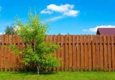 Is it worth staining an old fence?