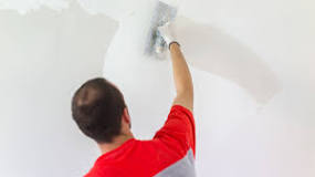 What do you use to skim coat a wall?