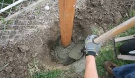 How do you dig a post hole in hard dirt?