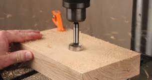 How do you drill a 1/2 inch hole in wood?
