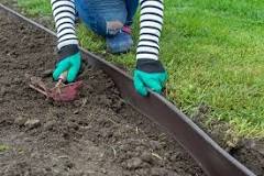 Should you put topsoil under mulch?