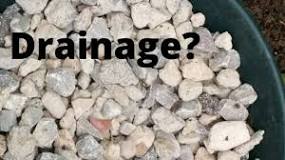 Can you put pebbles under soil?