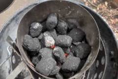 How do you spread charcoal evenly?