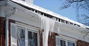 How do I remove snow and ice from my roof?
