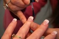 How do nail techs clean their tools?