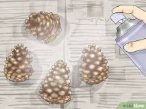 How do you clean and preserve pine cones?