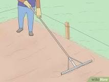 How do you level ground with a rake?
