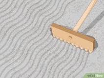 How do you rake a yard of sand?