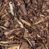 Should you rake up old mulch?