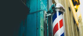 What does the red stripe on a barber pole mean?