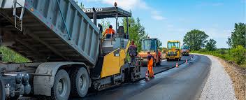 What equipment is used for asphalt paving?