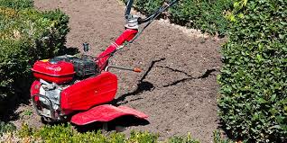 What is the purpose of raking soil?