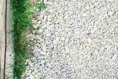 What to put down before gravel to prevent weeds?
