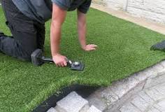 Whats cheaper real or fake grass?