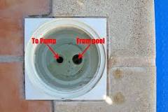 Why do pool skimmers have two holes?