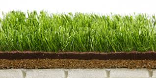 Why do you brush sand into artificial grass?